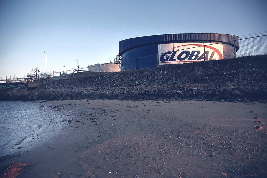A Global Partners oil storage tank at the edge of Casco Bay